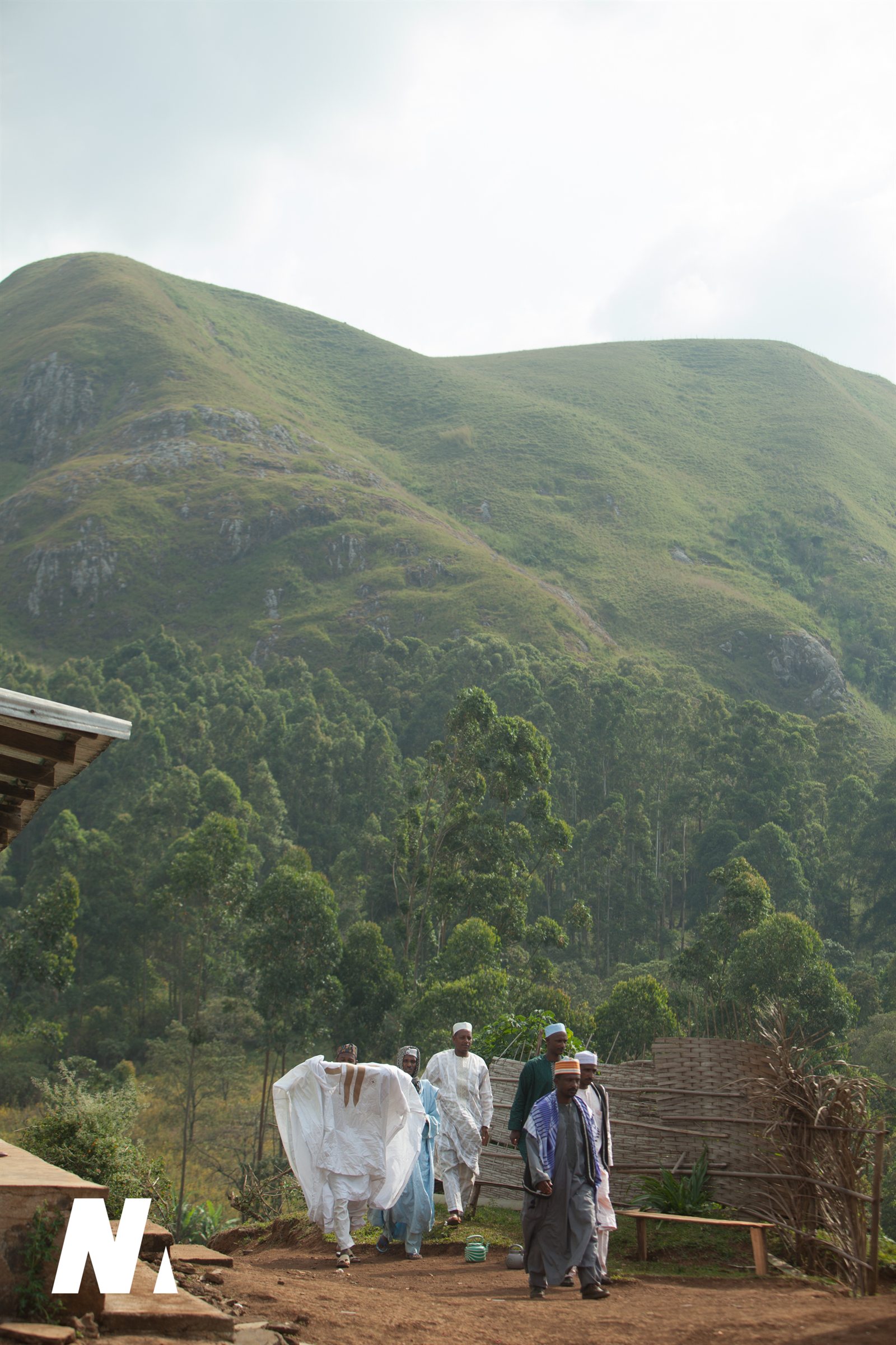 Mbororo men walking through a mountain village in Cameroon